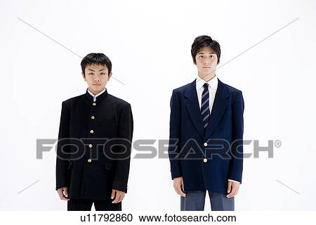 Stock Image - Two teenage boys standing. Fotosearch