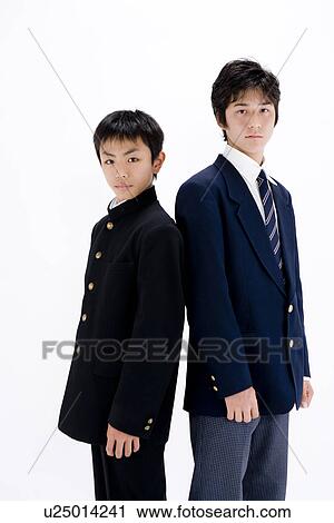 Two teenage boys standing View Large Photo Image Stock Image - Two teenage boys standing. Fotosearch