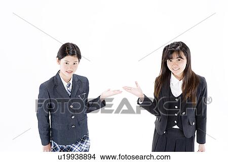 Picture - Two teenage girls introducing each other. Fotosearch