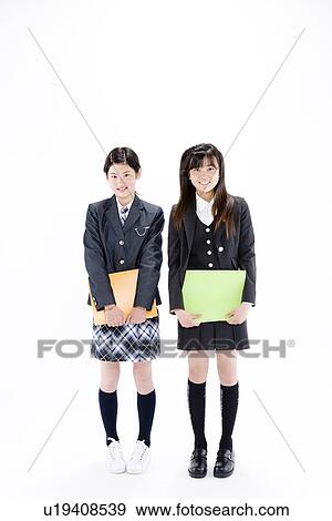 Two teenage girls standing View Large Photo Image Stock Photo - Two teenage girls standing. Fotosearch