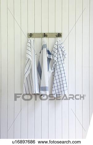 Kitchen clothes hanging on wall View Large Photo Image Stock Photograph - Kitchen clothes hanging on wall. Fotosearch
