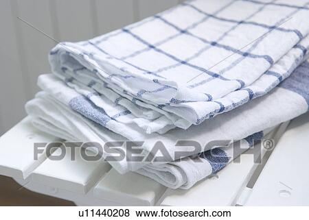 Stock Photo - Kitchen clothes on chair. Fotosearch