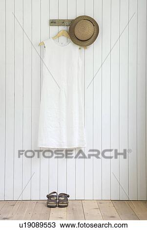 Linen dress hanging on wall View Large Photo Image Stock Image - Linen dress hanging on wall. Fotosearch