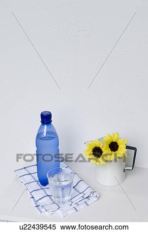 Mineral water and a glass of water View Large Photo Image Stock Photography - Mineral water and a glass of water. Fotosearch