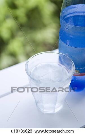 Stock Image - Mineral water and glass. Fotosearch