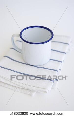 Stock Image - Mug on kitchen cloth. Fotosearch