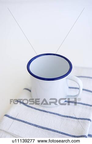 Stock Photo - Mug on kitchen cloth. Fotosearch