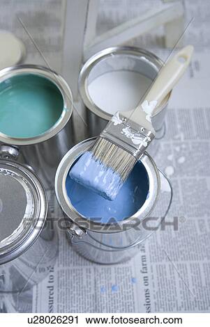 Stock Image - Paintbrush on paint can. Fotosearch