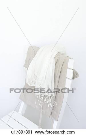 Stock Image - Scarf on chair. Fotosearch