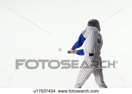 Picture - Baseball player hitting ball. Fotosearch