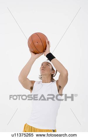 Basketball player shooting View Large Photo Image Stock Photography - Basketball player shooting. Fotosearch