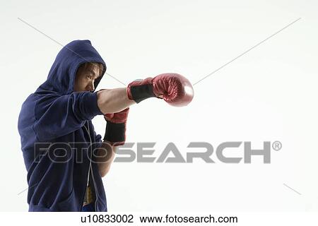 Boxer punching View Large Photo Image Stock Image - Boxer punching. Fotosearch