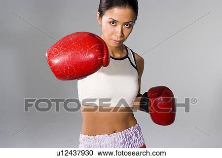 Stock Image - Female boxer posing. Fotosearch