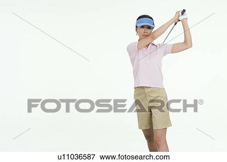 Stock Photo - Female golfer. Fotosearch