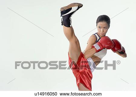 Stock Image - Female kick boxer. Fotosearch