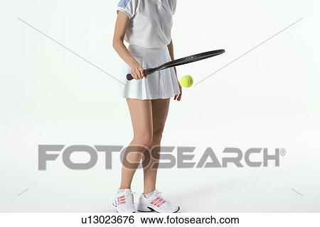 Female tennis player bouncing ball View Large Photo Image Stock Photograph - Female tennis player bouncing ball. Fotosearch