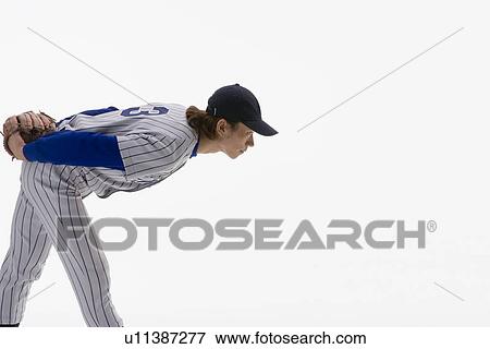 Pitcher preparing to throw a ball View Large Photo Image Stock Photo - Pitcher preparing to throw a ball. Fotosearch