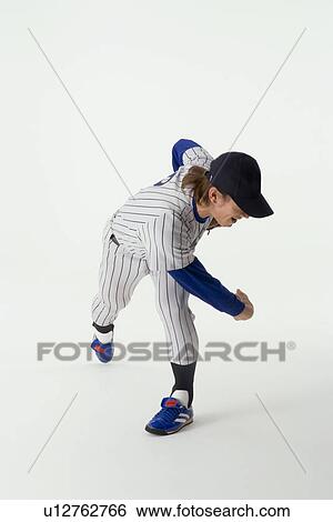 Stock Photograph - Pitcher throwing a ball. Fotosearch