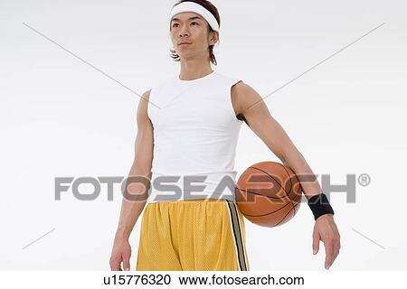 Stock Image - Portrait of basketball player. Fotosearch