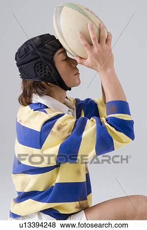 Rugby player praying View Large Photo Image Stock Photo - Rugby player praying. Fotosearch