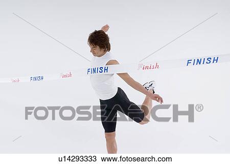 Runner finishing in first place View Large Photo Image Stock Image - Runner finishing in first place. Fotosearch