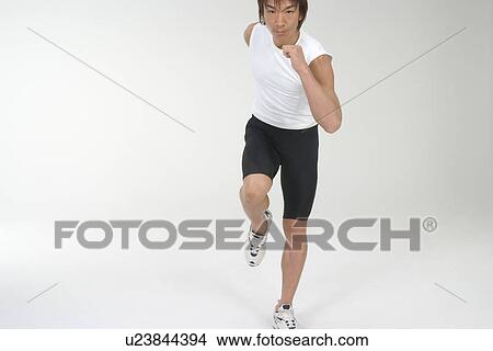 Picture - Young man running. Fotosearch