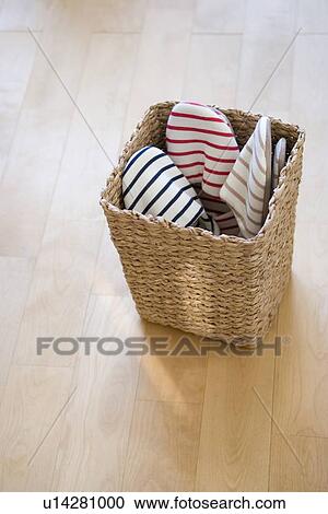 Stock Image - Baskets and boxes on shelf. Fotosearch