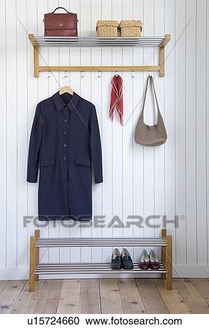 Coat and bag on hangers View Large Photo Image Stock Image - Coat and bag on hangers. Fotosearch