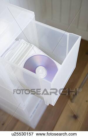 Stock Photo - Compact discs in drawer. Fotosearch