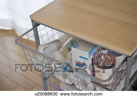 Stock Image - Detergents in drawer. Fotosearch