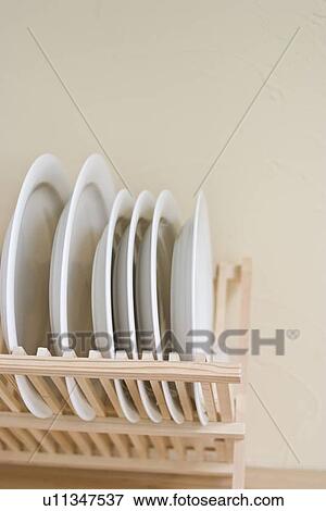 Stock Photo - Dishes in rack. Fotosearch