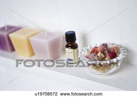 Stock Image - Potpourri and candles. Fotosearch