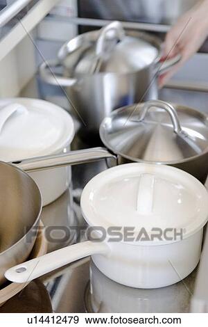 Stock Photo - Pots in drawer. Fotosearch