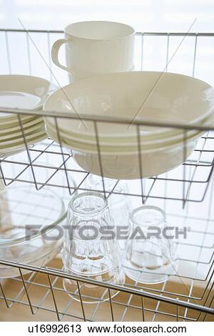 Stock Image - Tableware in rack. Fotosearch