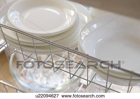 Stock Photo - Tableware in rack. Fotosearch