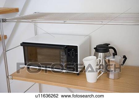 Stock Image - Toaster and cups. Fotosearch