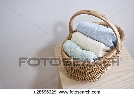 Stock Photography - Towels in basket. Fotosearch