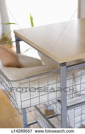Stock Photo - Woman picking towel on rack. Fotosearch