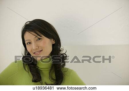 Stock Image - Portrait of mid adult woman. Fotosearch