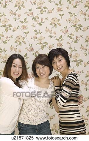 Stock Photography - Portrait of three young women. Fotosearch