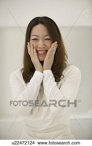 Portrait of young woman smiling View Large Photo Image Picture - Portrait of young woman smiling. Fotosearch