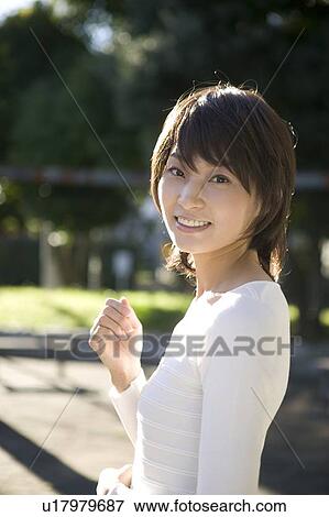 Portrait of young woman smiling View Large Photo Image Stock Photo - Portrait of young woman smiling. Fotosearch