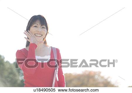 Young woman calling View Large Photo Image Stock Photography - Young woman calling. Fotosearch
