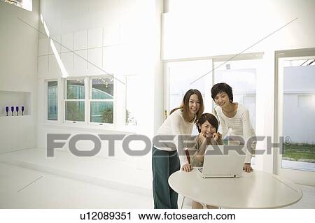 Young women using computer View Large Photo Image Stock Image - Young women using computer. Fotosearch