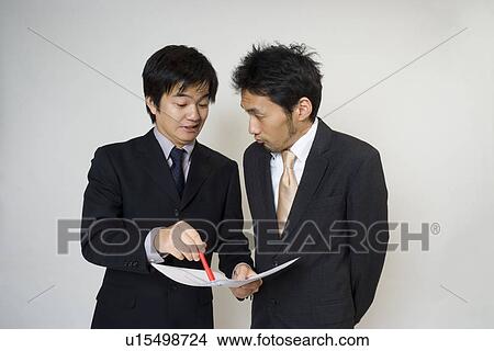 Picture - Businessman pointing out mistakes. Fotosearch