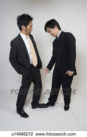 Businessman stepping on other's foot View Large Photo Image Stock Image - Businessman stepping on other's foot. Fotosearch