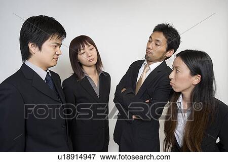 Stock Photo - Four people confronting. Fotosearch