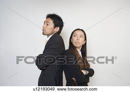 Two business people confronting View Large Photo Image Stock Photo - Two business people confronting. Fotosearch