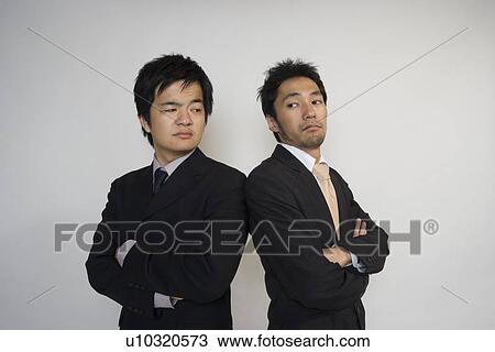 Stock Image - Two businessmen confronting. Fotosearch