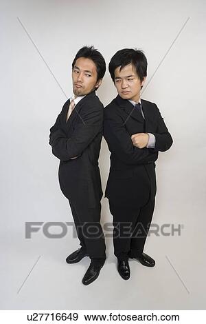 Two businessmen confronting View Large Photo Image Stock Photo - Two businessmen confronting. Fotosearch